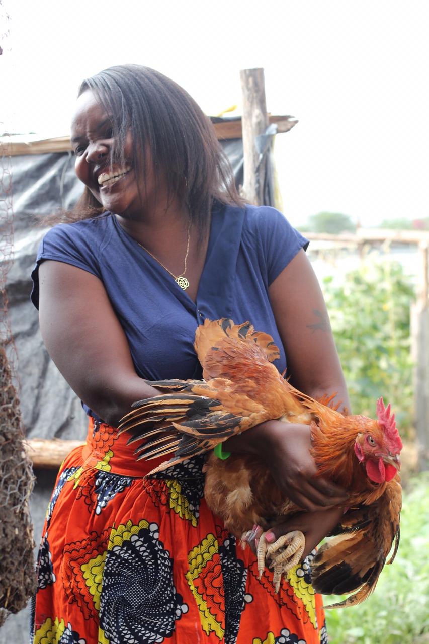 wangari holding a chicken